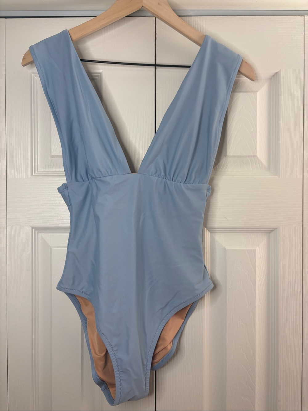 Women’s J. Crew deep V-neck one-piece swimsuit in a light blue shade size 6